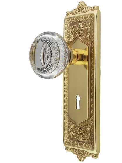 Egg and Dart Style Door Set with Ovolo Crystal-Glass Knobs and Keyhole in Polished Brass.